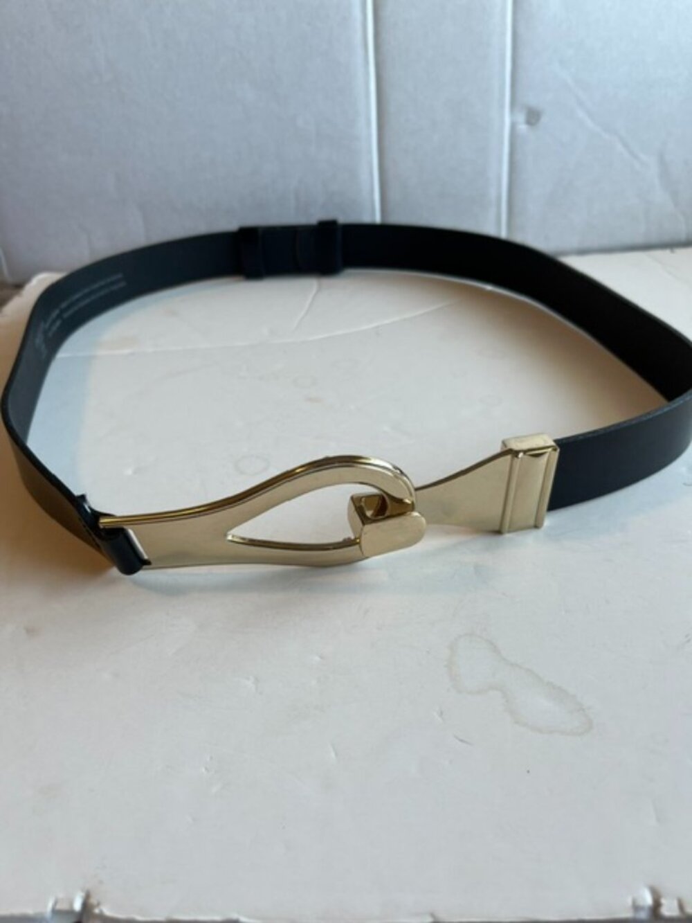 Danier leather belt with horse bit buckle.